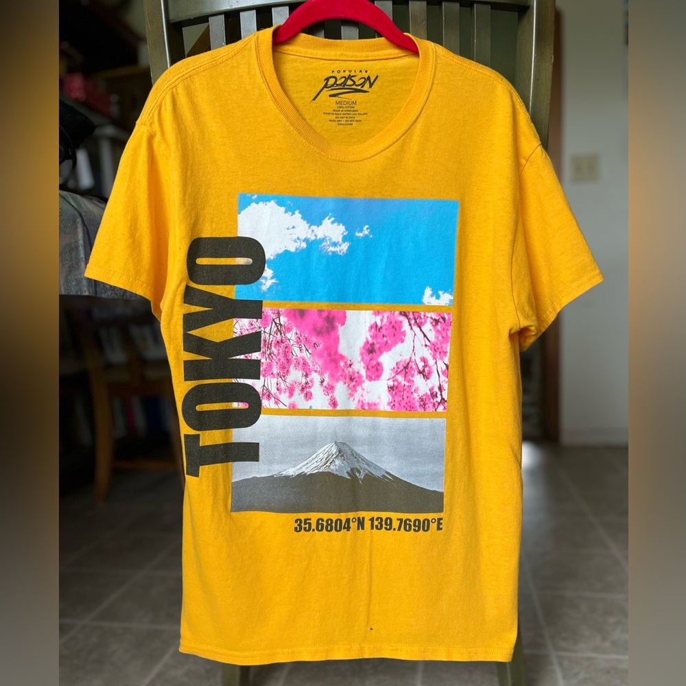 Tokyo bright gold colored graphic tee shirt. Men’s size M. 
One flaw